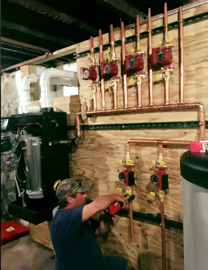 Advantage Air technician working on a hydronic heating install