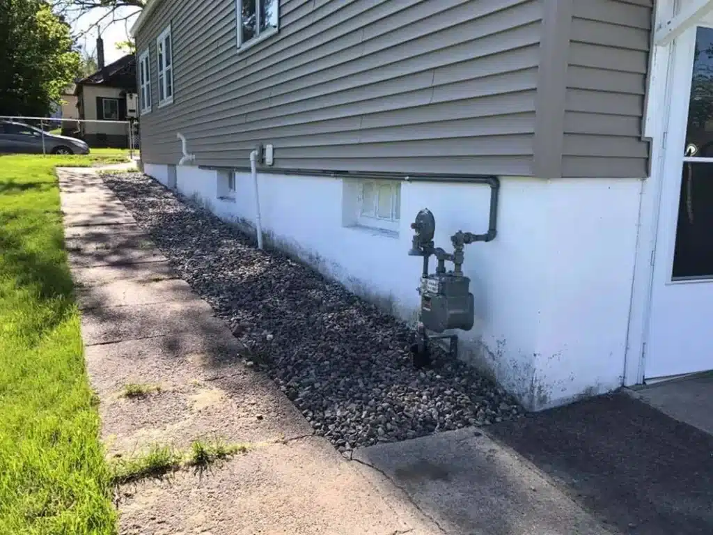 Gas line run along the foundation