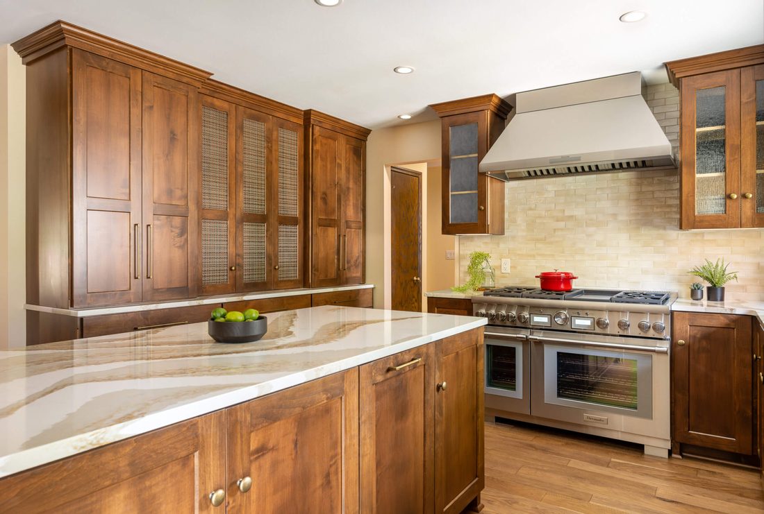 Walnut cabinetry kitchen with pro range