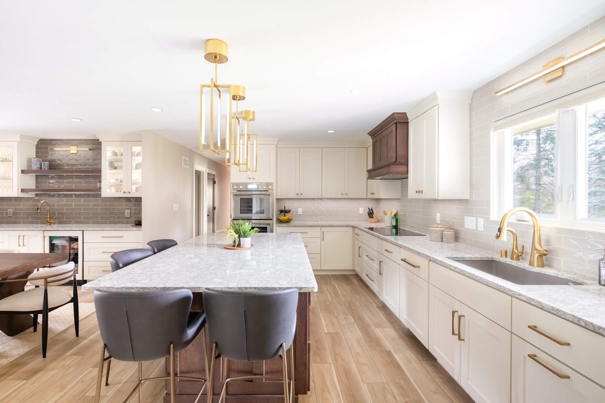 Bright kitchen remodel with gold pendants
