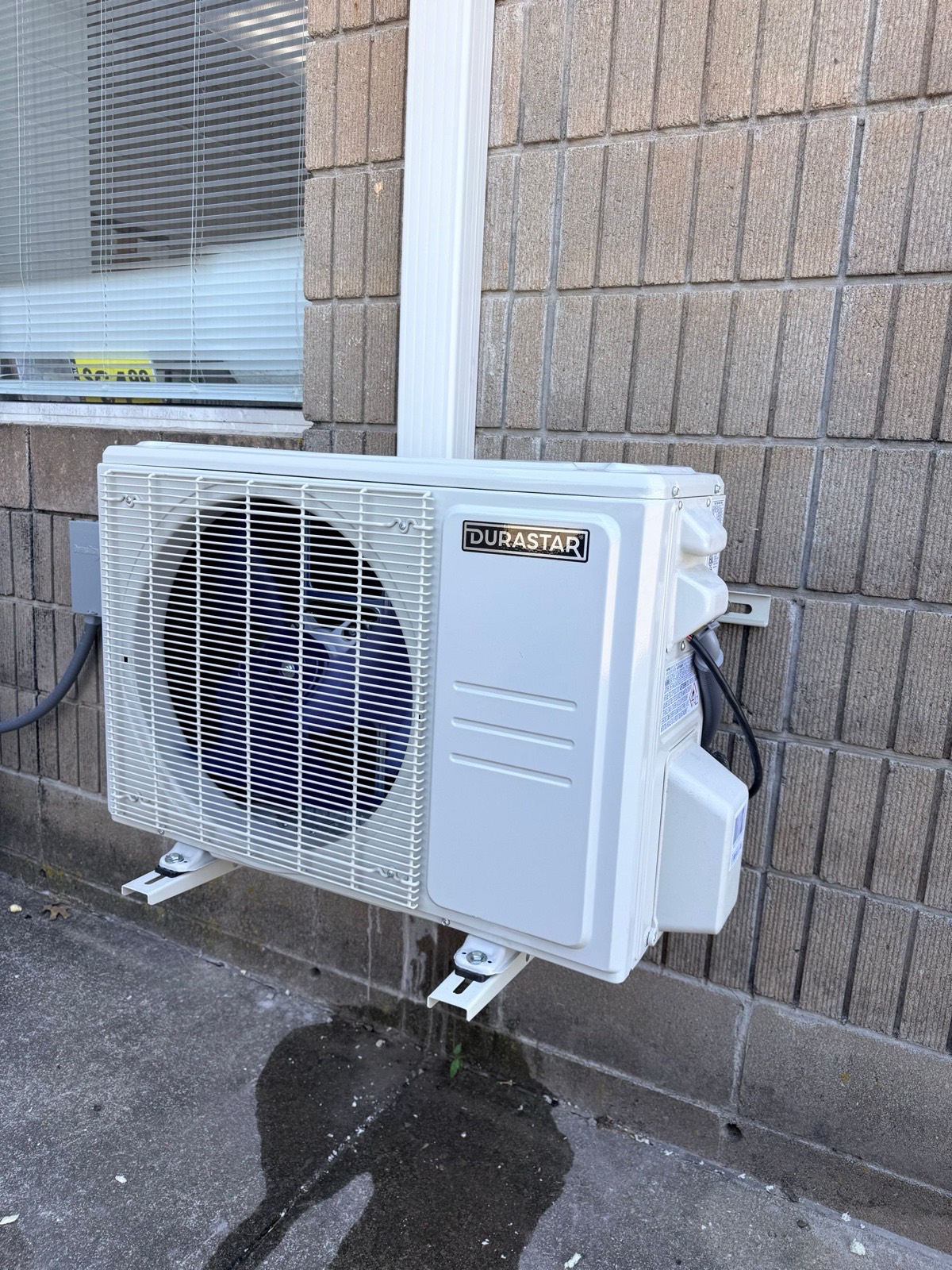 Durastar mini-split condenser wall-mounted at a light commercial building