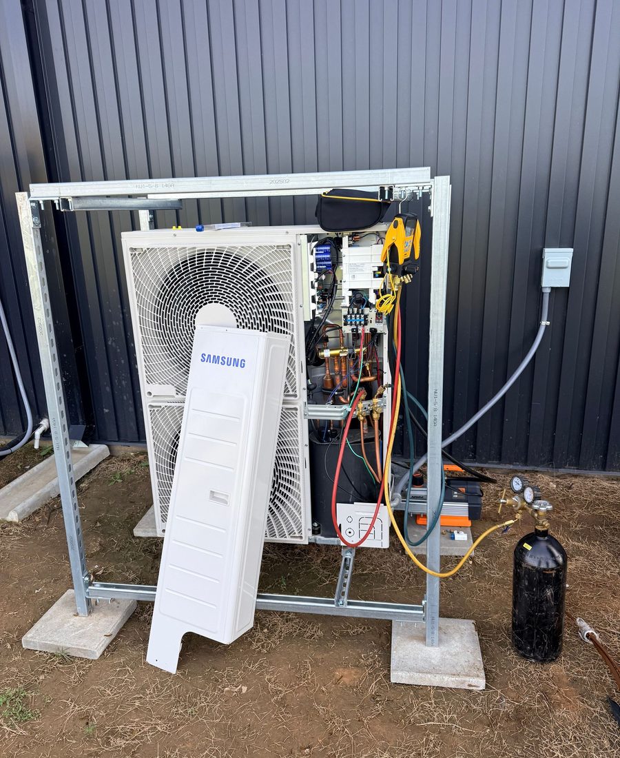 Samsung mini-split condenser installed on a wall-mount rack