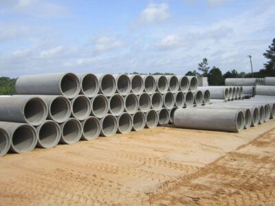 Reinforced concrete pipe stacked in the Del Zotto yard