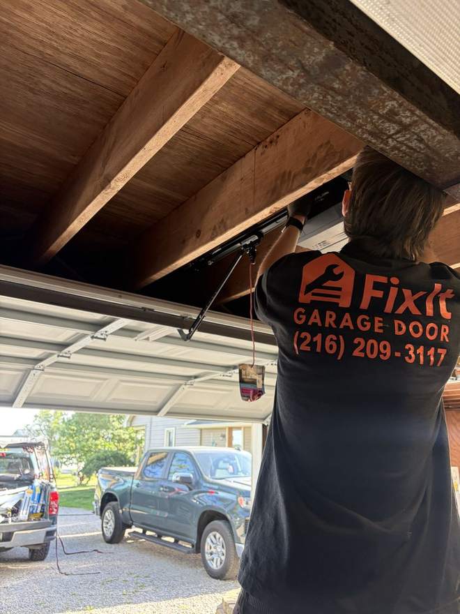 A FixIt technician repairing an opener rail
