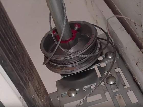 Garage door cable drum close-up