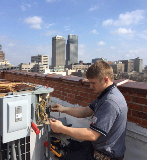 Fred's technician servicing a rooftop unit