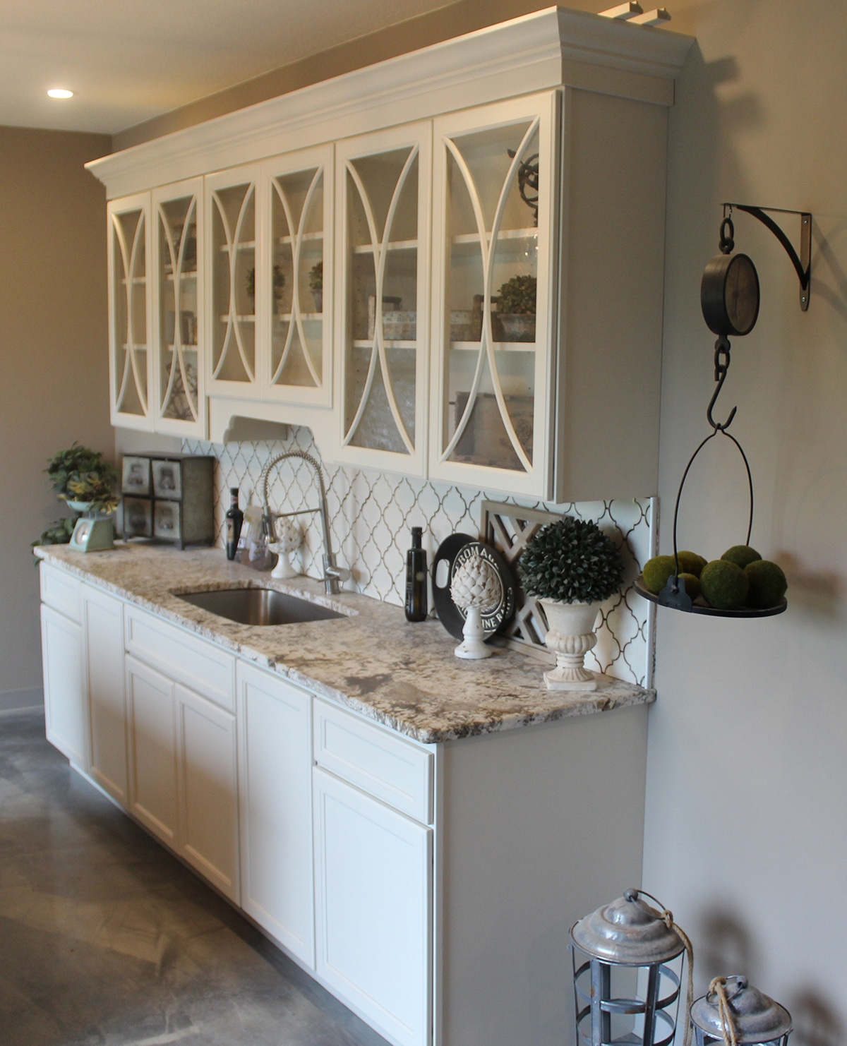 A finished granite countertop display with white cabinetry in the Granite Works showroom