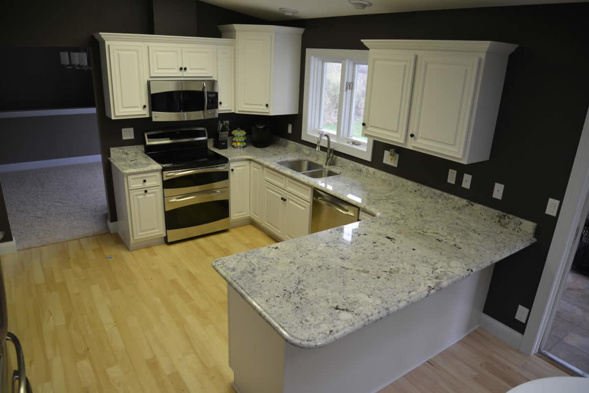 White cabinet kitchen with new granite counters
