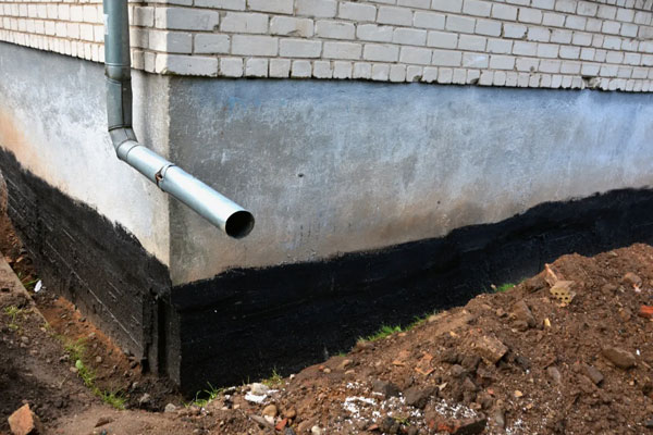 Discharge. Water routed away from the foundation.