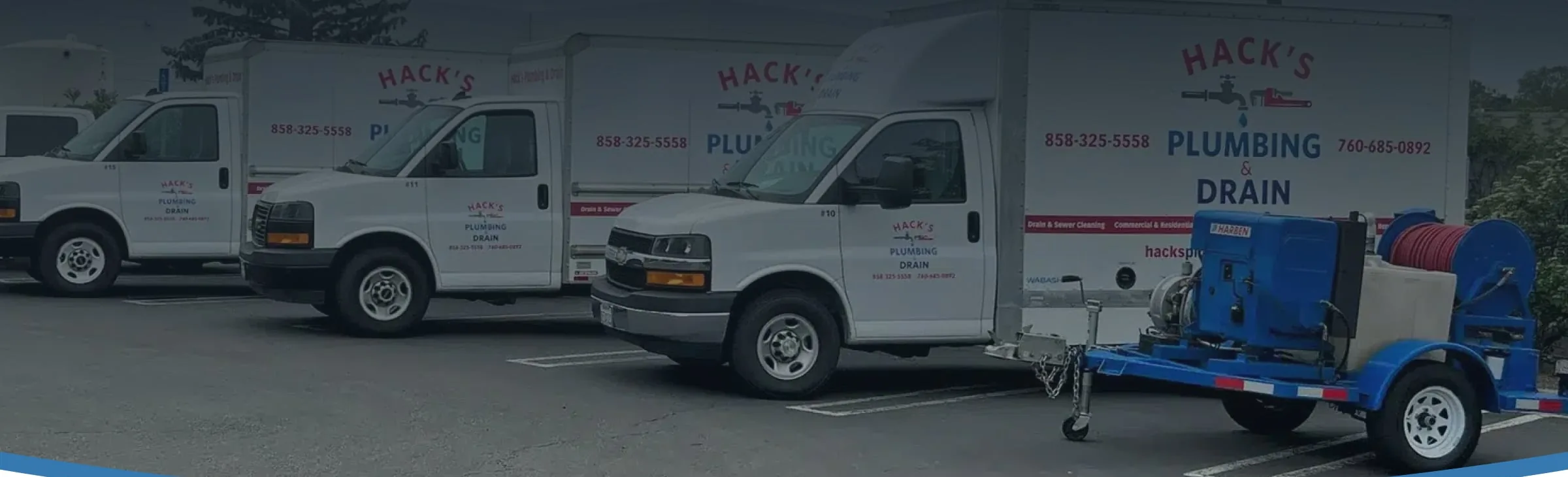 Hack's Plumbing and Drain service vans and hydro jetting trailer