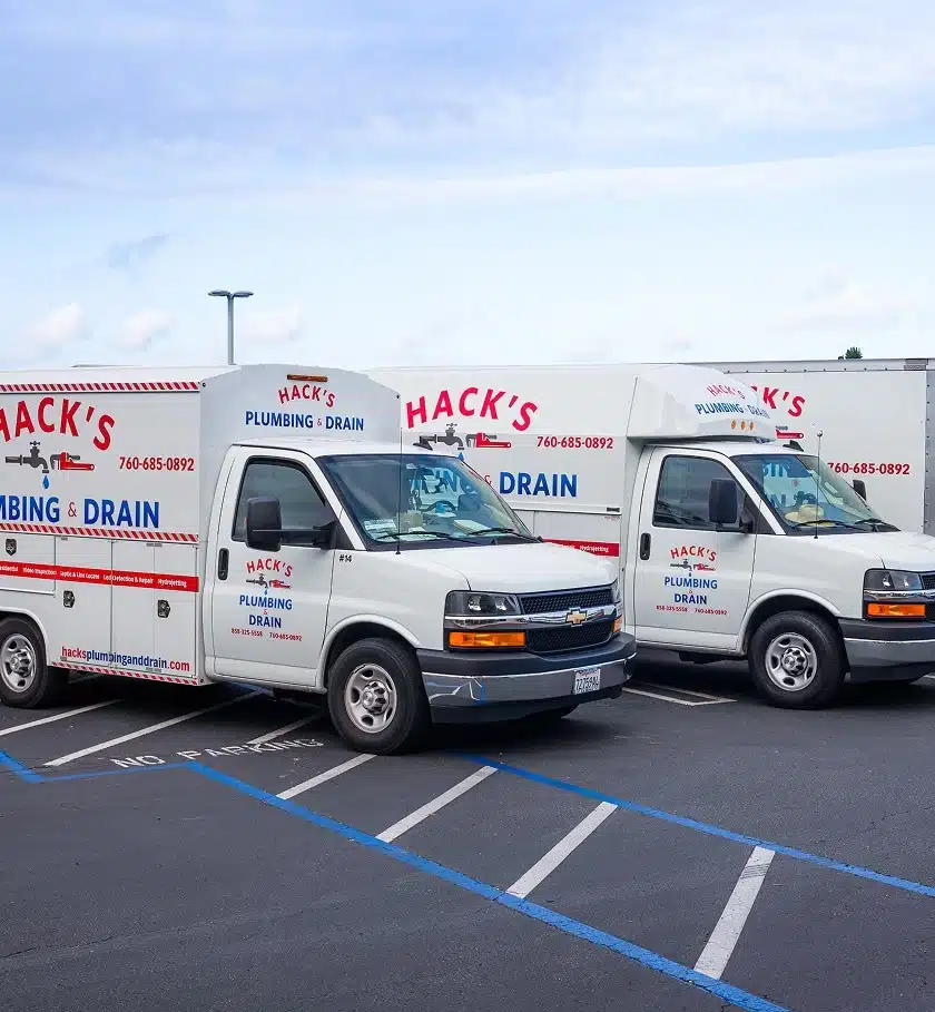 Hack's Plumbing and Drain service trucks