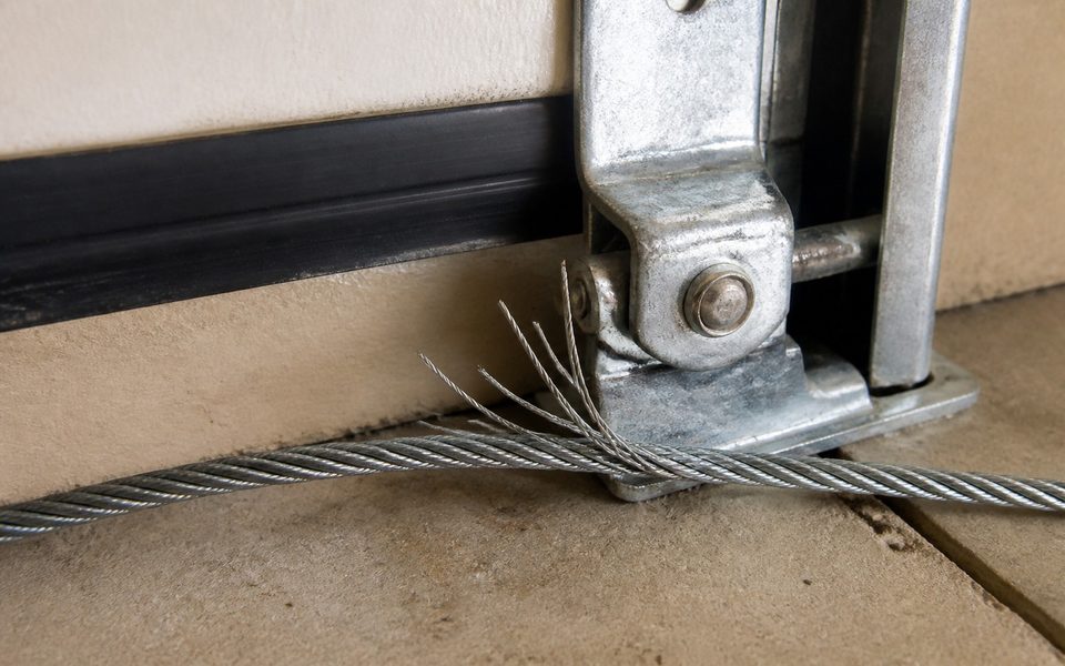 Damaged garage door lift cable, the kind of failure that needs same-day attention