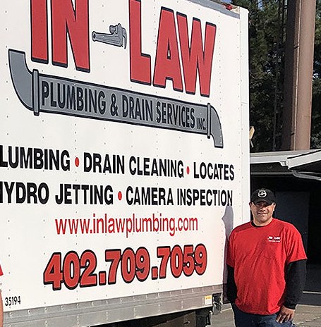 The In-Law Plumbing service truck with its full list of services: plumbing, drain cleaning, locates, hydro jetting, and camera inspection