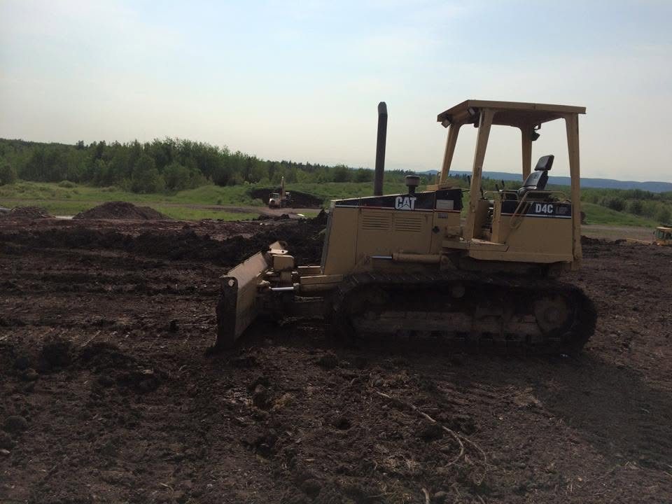 Cat dozer grading a pad