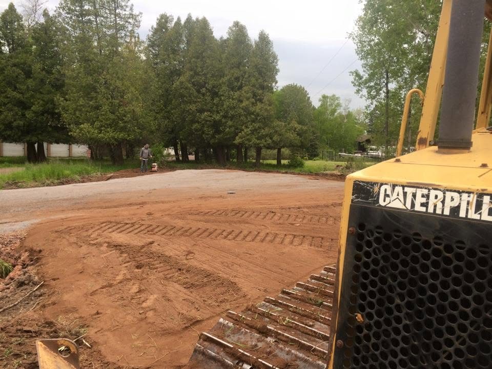 Dozer grading a new gravel driveway
