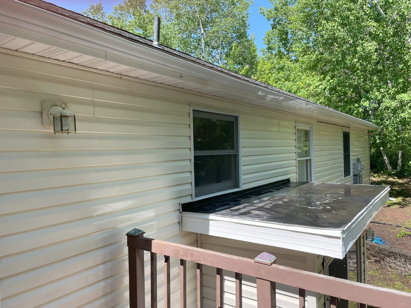 Same gutter exterior after whitening, bright and clean