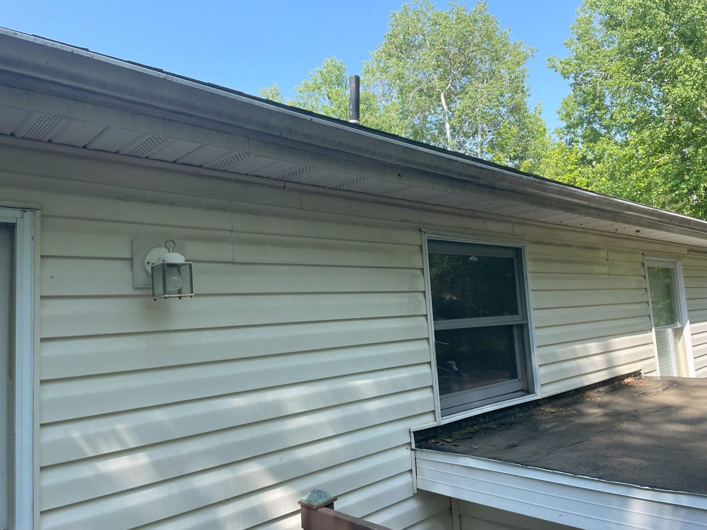 Gutter exterior streaked and oxidized before whitening