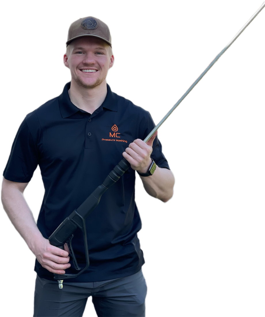 MC Pressure Washing co-owner in branded polo with wash wand