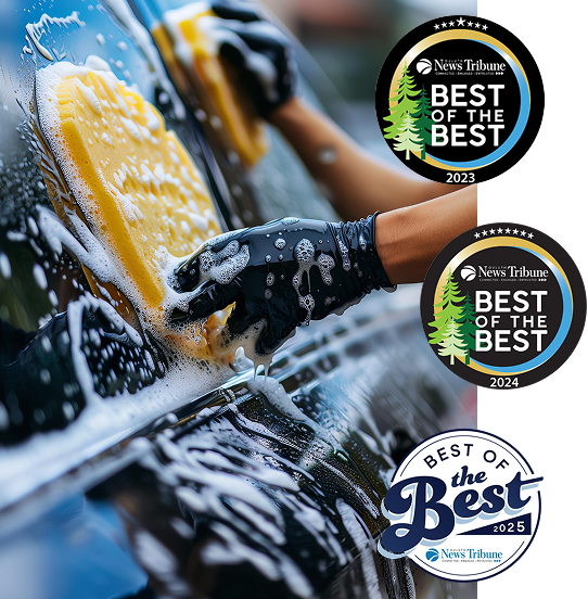 Hand washing a vehicle with Duluth News Tribune Best of the Best award badges for 2023, 2024, and 2025