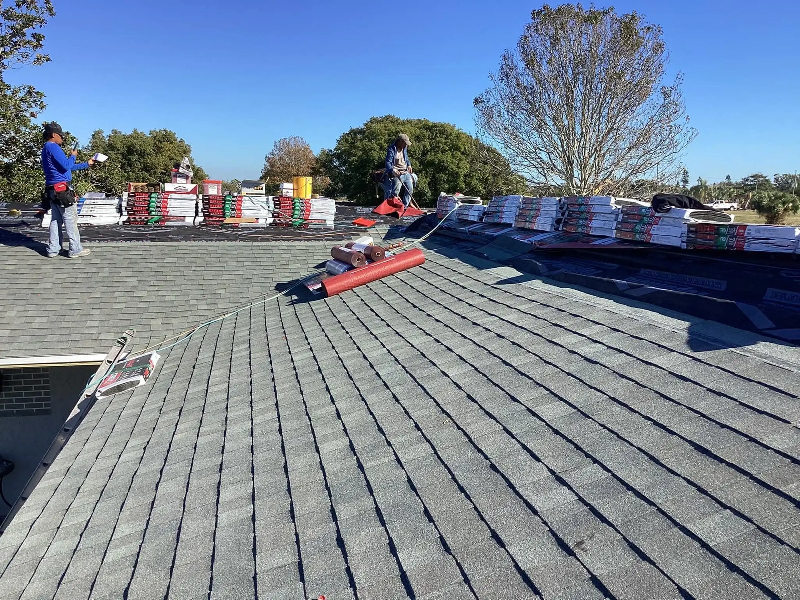 RoofSource crew installing storm-rated shingles
