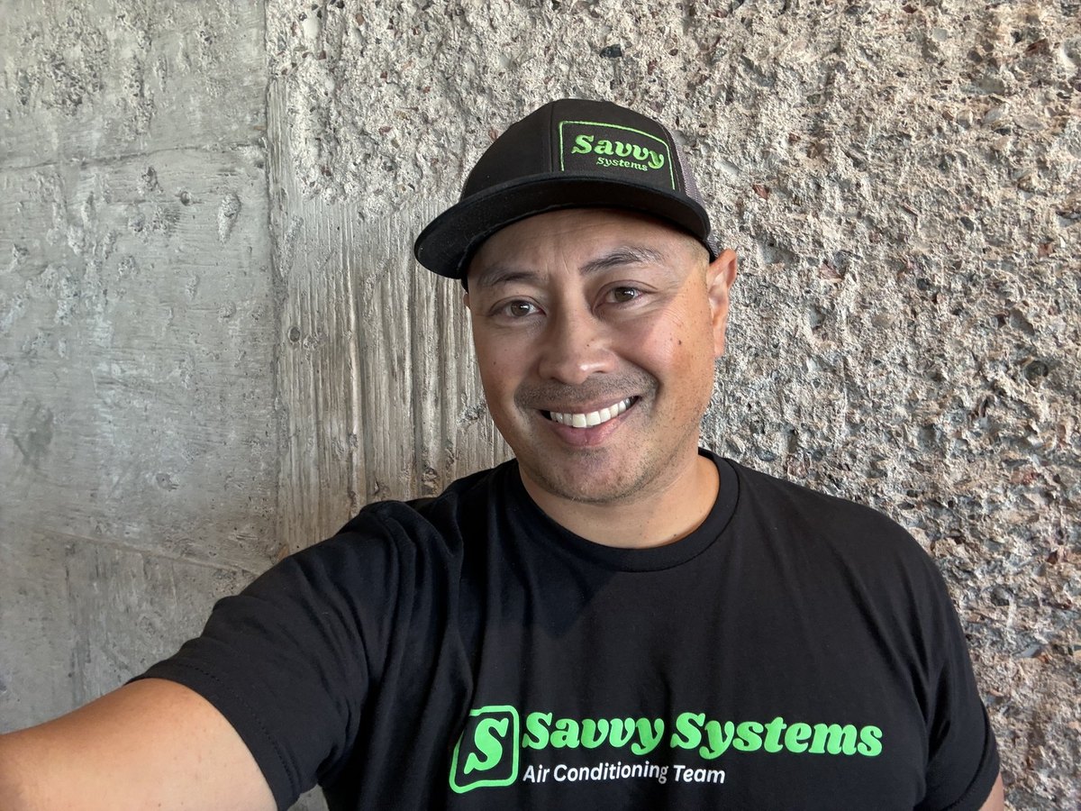 Ricky of Savvy Systems in a branded cap and shirt