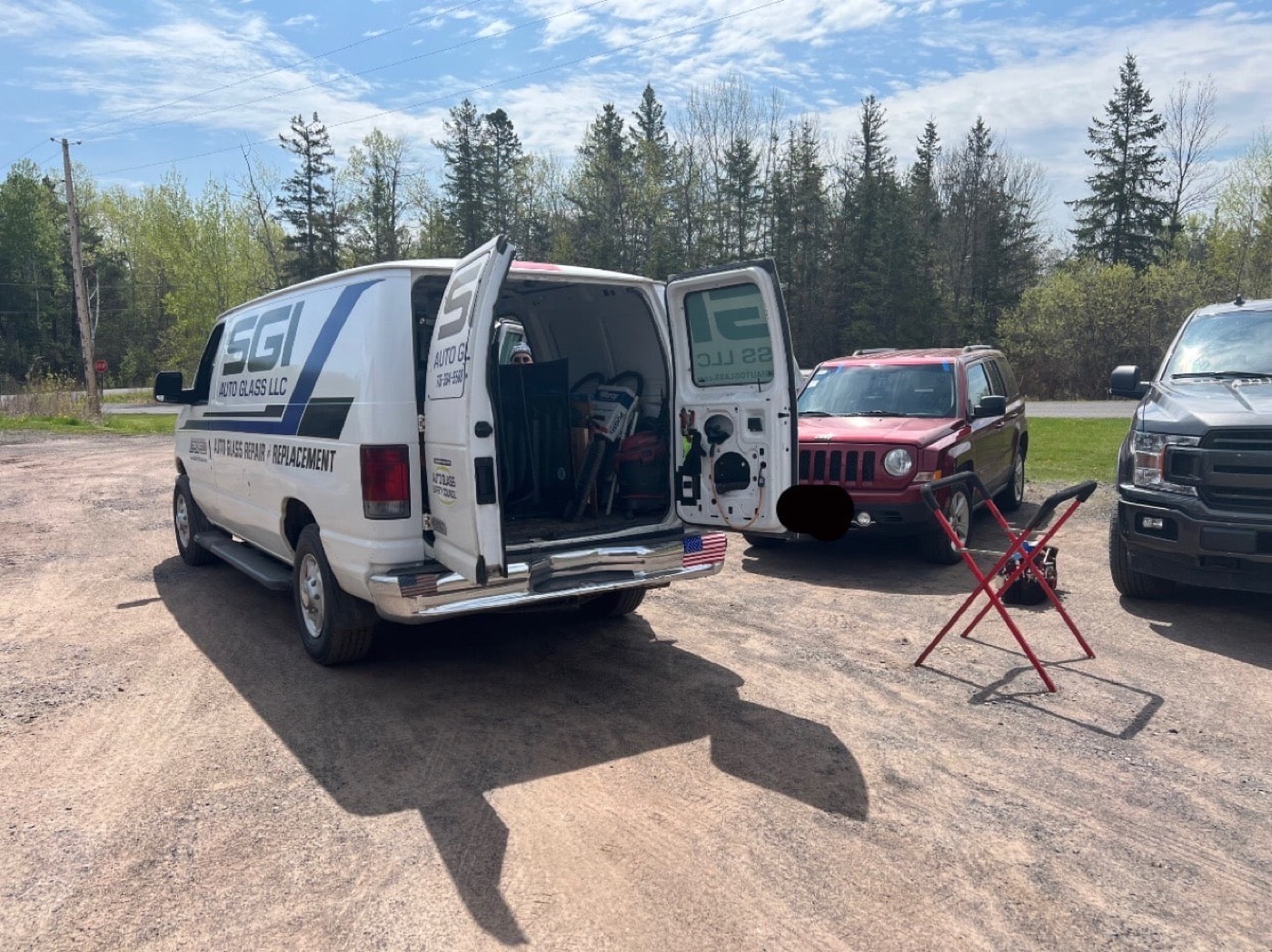The SGI Auto Glass van open on a job site