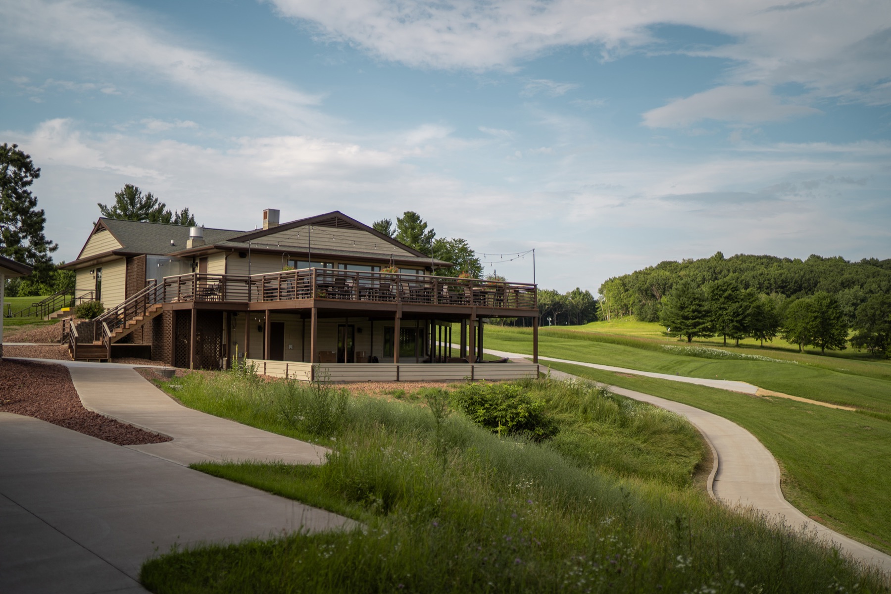 The Tanglewood Greens clubhouse and deck above the course