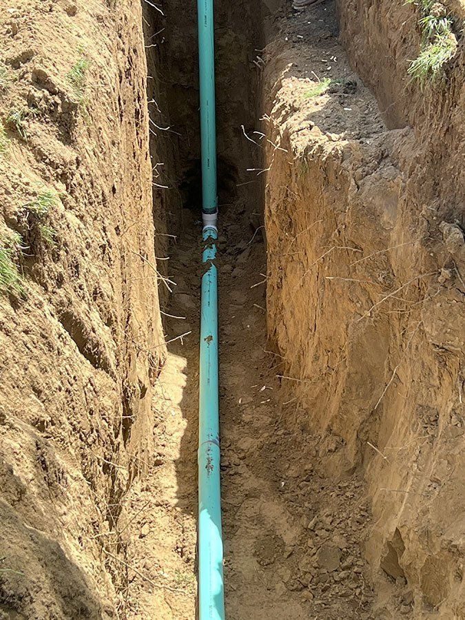 Viper crew's completed sewer line replacement in an excavated trench