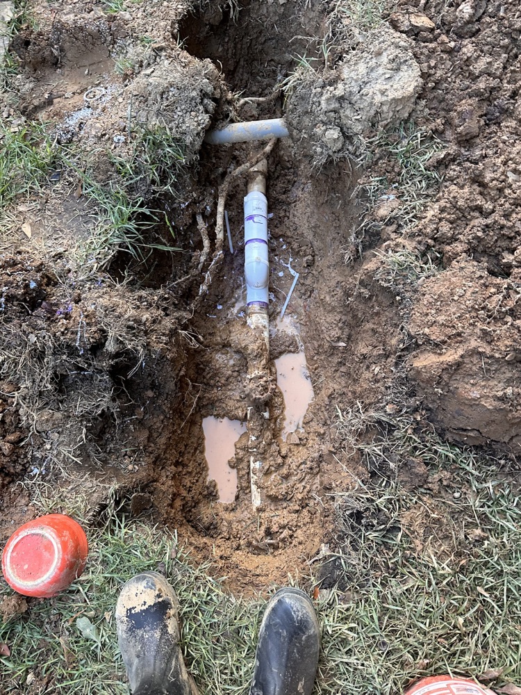 Water service line repaired in a trench