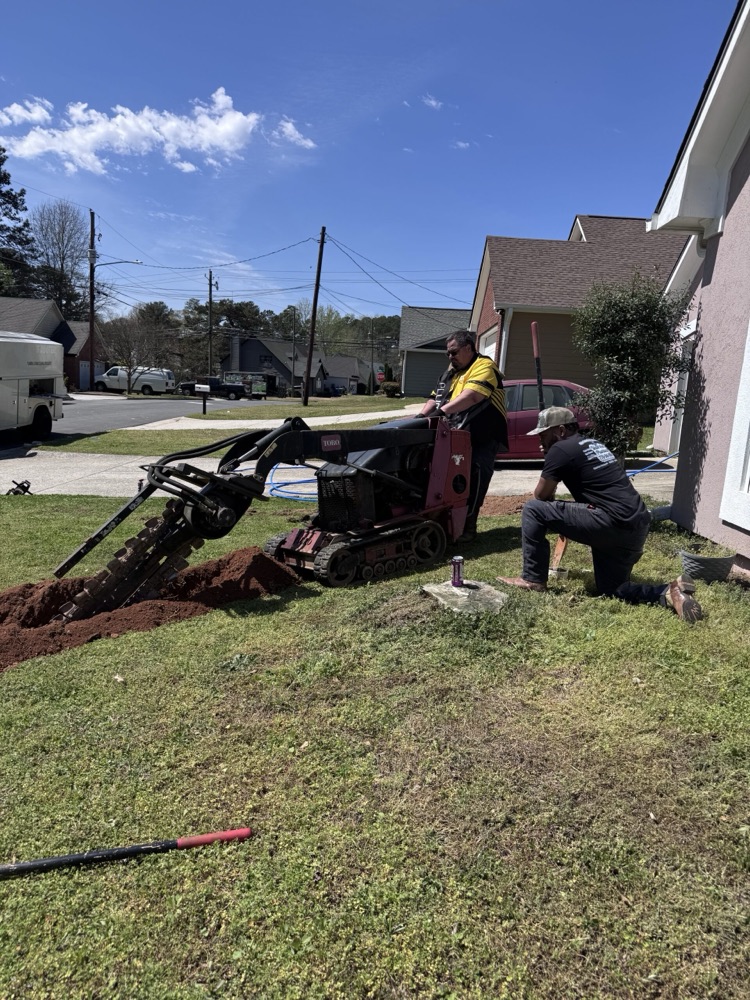 Crew working on a yard water line replacement